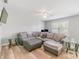 Spacious living room with L-shaped sectional sofa and wood-look floors at 1219 Century Dr, Clover, SC 29710