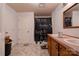 Bathroom featuring double vanity, walk-in shower with decorative curtain, and tile flooring at 1304 Cambridge Dr, Shelby, NC 28152