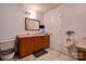 Bathroom featuring double vanity, tile flooring, and a standard toilet and urinal at 1304 Cambridge Dr, Shelby, NC 28152