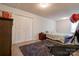 Bedroom featuring a bed, dark gray rug, and a double door closet at 1304 Cambridge Dr, Shelby, NC 28152