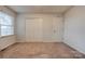 Bedroom with a window and a double door closet at 1304 Cambridge Dr, Shelby, NC 28152