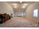 Large bonus room with neutral carpet, ample lighting, and lots of space at 1304 Cambridge Dr, Shelby, NC 28152