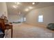 Side view of the spacious bonus room with neutral carpet, high ceiling and windows for natural light at 1304 Cambridge Dr, Shelby, NC 28152