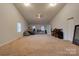 Another view of this spacious bonus room with neutral carpet, high ceiling and windows for natural light at 1304 Cambridge Dr, Shelby, NC 28152