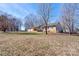 Lovely landscaped lawn with a beautiful single-Gathering brick home, with a blue sky above at 1304 Cambridge Dr, Shelby, NC 28152