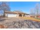 Charming brick home with a two-car garage and well-maintained front yard on a clear day at 1304 Cambridge Dr, Shelby, NC 28152