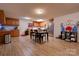 Spacious eat-in kitchen features wooden cabinetry, stainless steel appliances, and a dining table at 1304 Cambridge Dr, Shelby, NC 28152