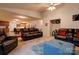 Spacious living area with plush sofas, area rug, and an open layout into the dining area at 1304 Cambridge Dr, Shelby, NC 28152