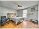 Cozy bedroom featuring a wooden headboard and plenty of natural light at 1309 Winding Branch Ct, Charlotte, NC 28216