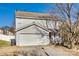 Two-story house with attached garage and front yard at 1309 Winding Branch Ct, Charlotte, NC 28216