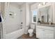 Bathroom with subway tile and a bathtub at 1482 Hubert Graham Way, Tega Cay, SC 29708