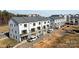 Aerial view of new townhouses with attached garages and balconies at 15306 Ballancroft Pkwy # 21, Charlotte, NC 28277