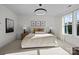 Spacious bedroom with king bed, large window, and neutral color palette at 15306 Ballancroft Pkwy # 21, Charlotte, NC 28277