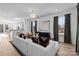 Modern living room with neutral decor and large windows at 15306 Ballancroft Pkwy # 21, Charlotte, NC 28277