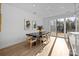 Sunlit dining area with a black table, and sliding glass doors at 15310 Ballancroft Pkwy # 20, Charlotte, NC 28277