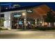 An outdoor restaurant is shown with large windows and modern lighting at 15310 Ballancroft Pkwy # 20, Charlotte, NC 28277