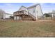 Elevated back deck with stairs and a fenced backyard at 1544 Farmington Hills Dr, Conover, NC 28613