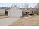 Gray house with attached garage and front porch at 1544 Farmington Hills Dr, Conover, NC 28613