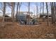 Fire pit and seating area in backyard at 1544 Farmington Hills Dr, Conover, NC 28613