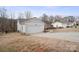 Attached garage with white door and ample driveway space at 1544 Farmington Hills Dr, Conover, NC 28613