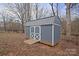 Gray storage shed with white trim at 1544 Farmington Hills Dr, Conover, NC 28613