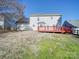 House backyard with deck and grassy lawn at 156 Elrosa Rd, Mooresville, NC 28115