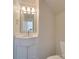 Elegant powder room with marble vanity and decorative mirror at 156 Elrosa Rd, Mooresville, NC 28115