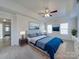 Large bedroom with ceiling fan and neutral carpeting at 156 Elrosa Rd, Mooresville, NC 28115