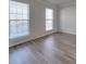 Spacious bedroom with hardwood floors and two large windows at 156 Elrosa Rd, Mooresville, NC 28115