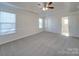 Spacious bedroom with ceiling fan and access to bathroom at 156 Elrosa Rd, Mooresville, NC 28115