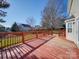 Back deck with red stained wood and backyard view at 156 Elrosa Rd, Mooresville, NC 28115