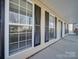 Front porch view of house with black shutters and a front door at 156 Elrosa Rd, Mooresville, NC 28115