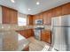 Modern kitchen featuring stainless steel appliances and wood cabinets at 156 Elrosa Rd, Mooresville, NC 28115