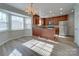 Kitchen with island, wood cabinets, and stainless steel appliances at 156 Elrosa Rd, Mooresville, NC 28115