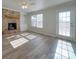 Living room features stone fireplace and wood-look floors at 156 Elrosa Rd, Mooresville, NC 28115