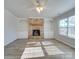 Living room with stone fireplace and built-in shelving at 156 Elrosa Rd, Mooresville, NC 28115