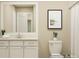 Bathroom featuring white vanity, toilet and large mirror at 1572 Croyden St, Indian Land, SC 29707