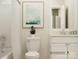 Clean bathroom with white vanity, bathtub, and framed art at 1572 Croyden St, Indian Land, SC 29707