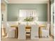 Dining room with light wood table, white chairs, and green walls at 1572 Croyden St, Indian Land, SC 29707