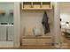 Entryway with bench, shelves, and coat hooks at 1572 Croyden St, Indian Land, SC 29707