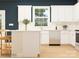 Modern kitchen with white cabinets and an island at 1602 Croyden St, Indian Land, SC 29707