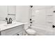 Bathroom with gray vanity, shower, and bathtub at 1715 Pope Ave, Gastonia, NC 28052