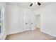 Spacious bedroom with double doors and ceiling fan at 1715 Pope Ave, Gastonia, NC 28052