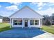 White exterior home with a covered porch and a two-car driveway at 1715 Pope Ave, Gastonia, NC 28052