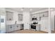 Modern kitchen with gray cabinets, white subway tile, and stainless steel appliances at 1715 Pope Ave, Gastonia, NC 28052