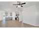 Open concept living space with kitchen, light flooring and ceiling fan at 1715 Pope Ave, Gastonia, NC 28052