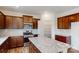 Modern kitchen with granite countertops and dark wood cabinets at 2125 Clifton Rd, Sherrills Ford, NC 28673