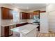 Modern kitchen with dark wood cabinets, granite countertops, and stainless steel appliances at 2125 Clifton Rd, Sherrills Ford, NC 28673