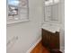 Clean bathroom with vanity, mirror, and wood-toned flooring at 2154 Pheasant Glen Rd, Charlotte, NC 28214