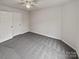 Bedroom with grey carpet and double doors at 2154 Pheasant Glen Rd, Charlotte, NC 28214